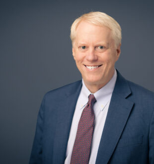 A headshot of Alan Matheson