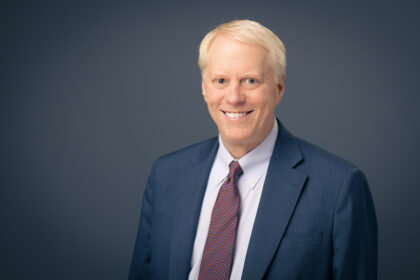 A headshot of Alan Matheson