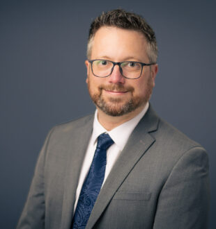 A headshot of Daniel McCabe